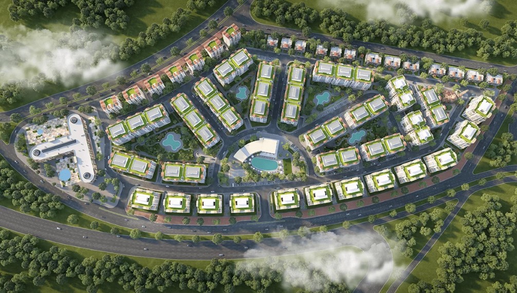 Ariel view of compound with gardens and pool